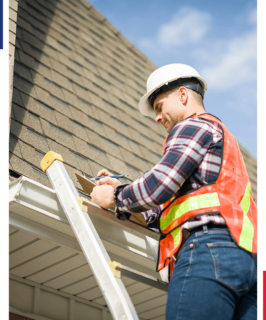 Worker inspecting roof with clipboard