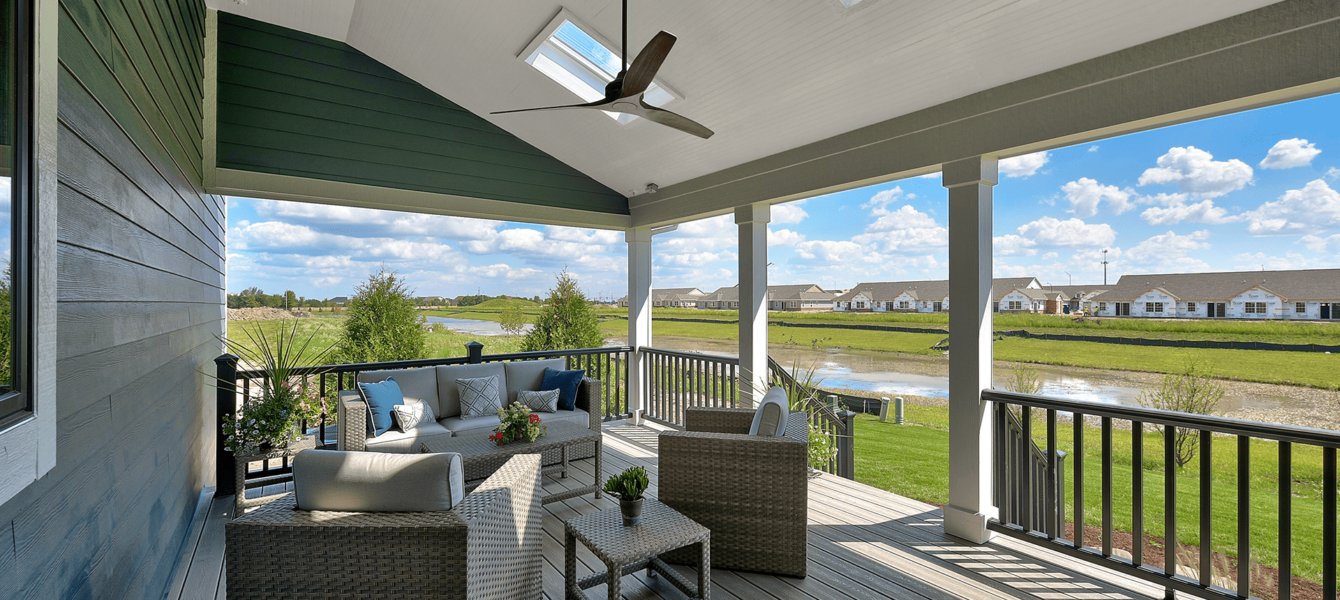 Comfortable patio overlooking grassy landscape